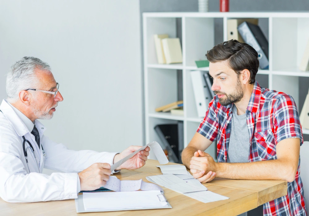 Doctor performing penile Doppler ultrasound for erectile dysfunction diagnosis