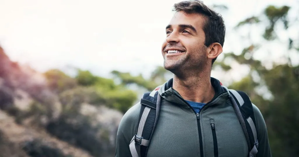 A man smiling in nature